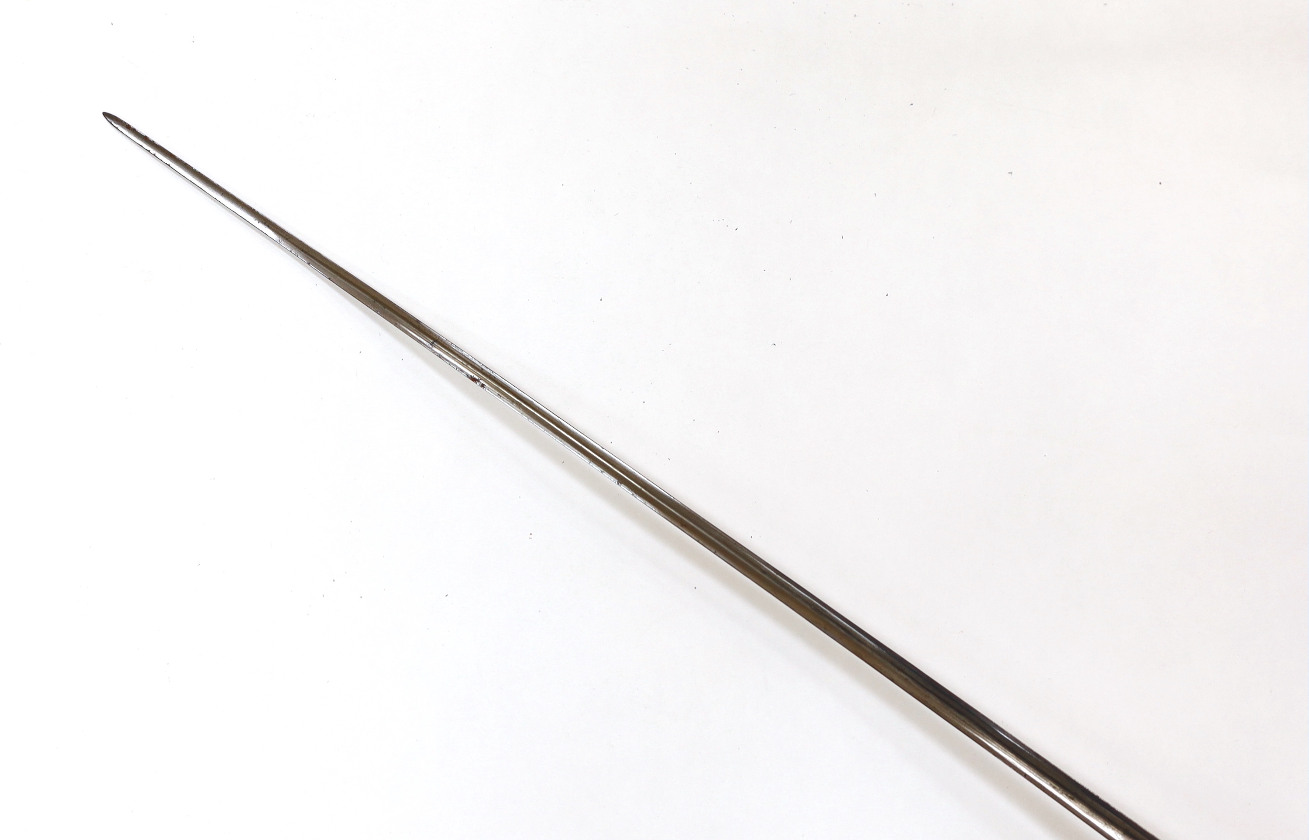 A French iron hilted small sword, hilt with flutes and tiny gold dots, the knuckle guard with key decoration, iron tape and silver wire bound grip, colichemarde blade with etched strapwork decoration, c.1770, blade 83cm